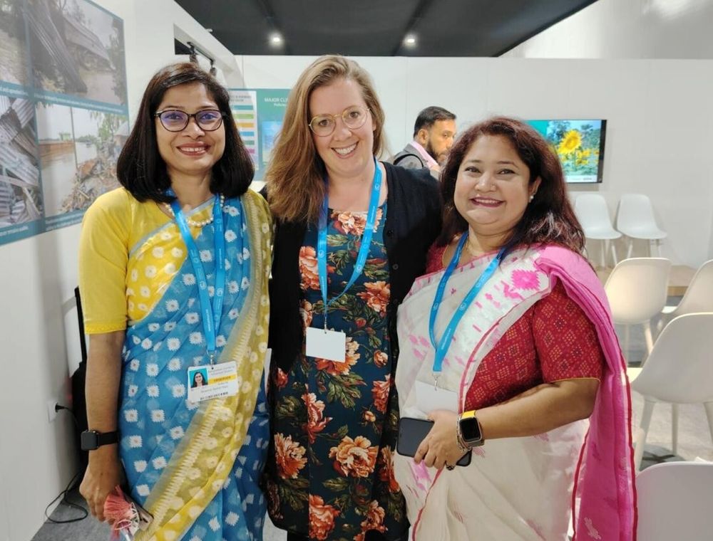 Dr Emma Lawrance (centre) at COP29