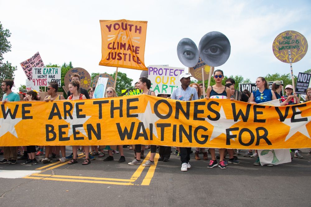 Youth Climate Justice protest - people with banners