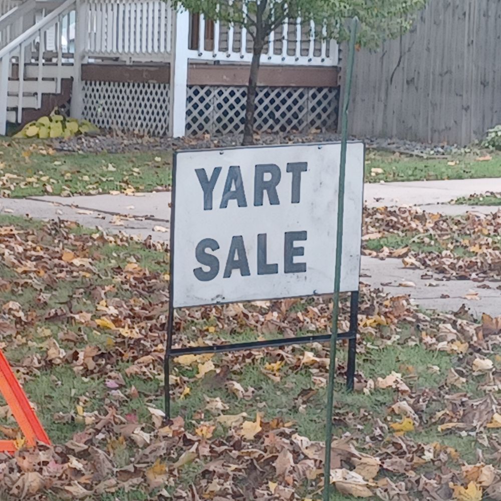 A yard sign that says "YART SALE."