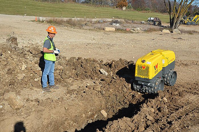 Remote trench roller