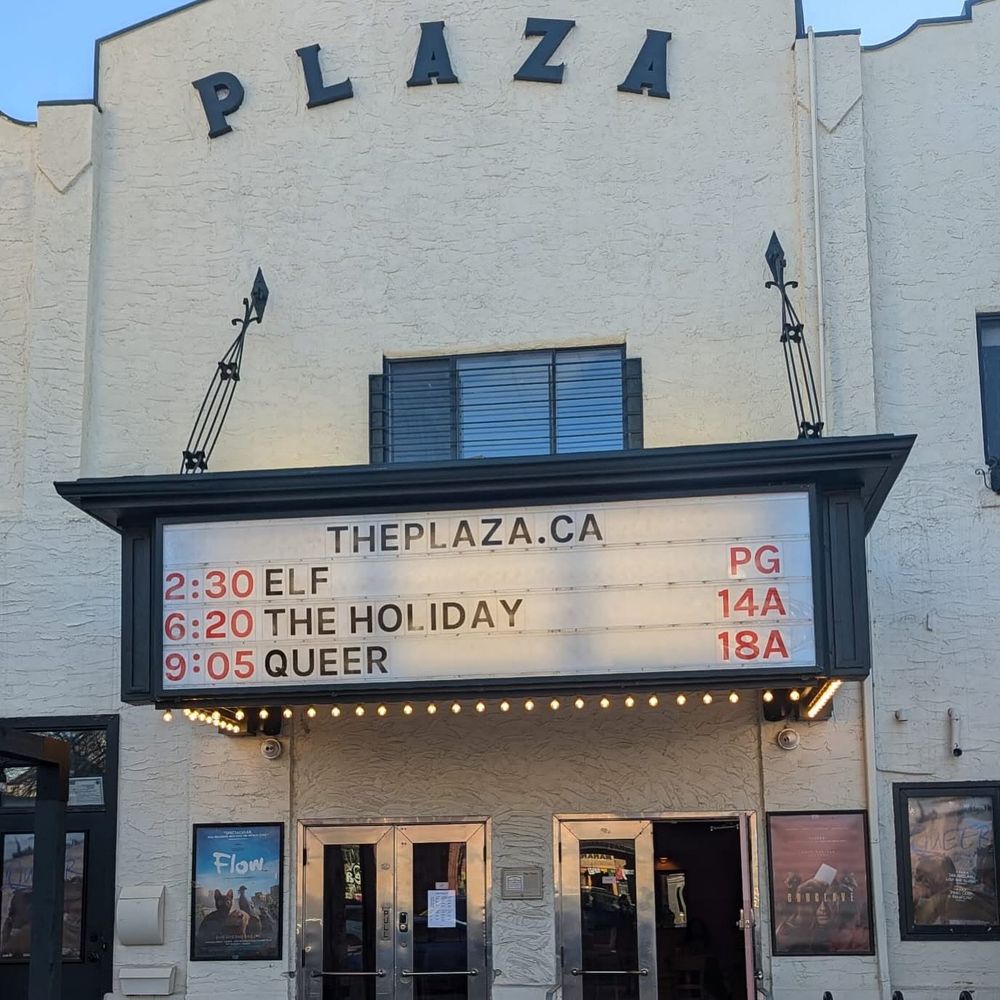 Marquee of Plaza movie theatre. Movie titles on marquee read

ELF
THE HOLIDAY 
QUEER

photo credit Graham Clark