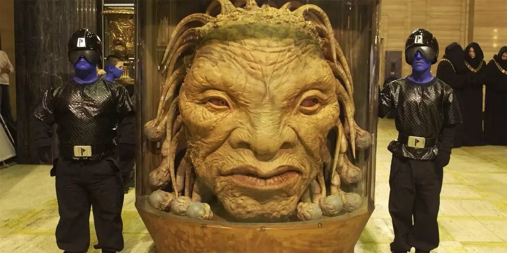 The Face of Boe from Doctor Who. A large disembodied head in a tank of fluid. 