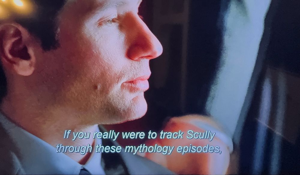 Spender’s hand on his shoulder. 