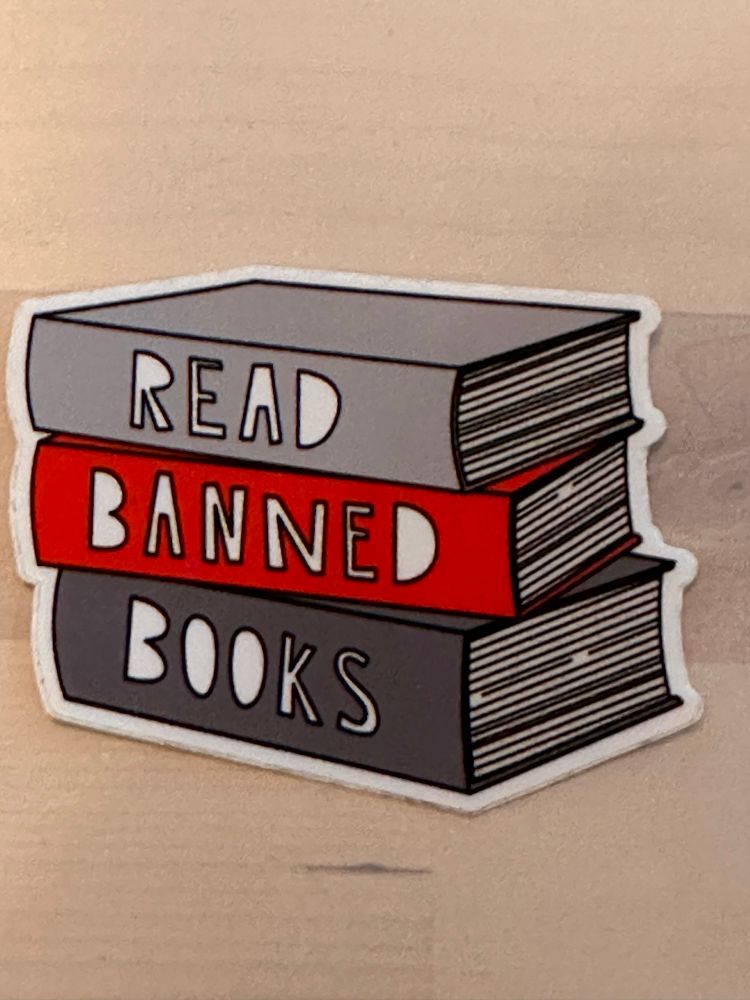A sticker that says READ BANNED
BOOKS