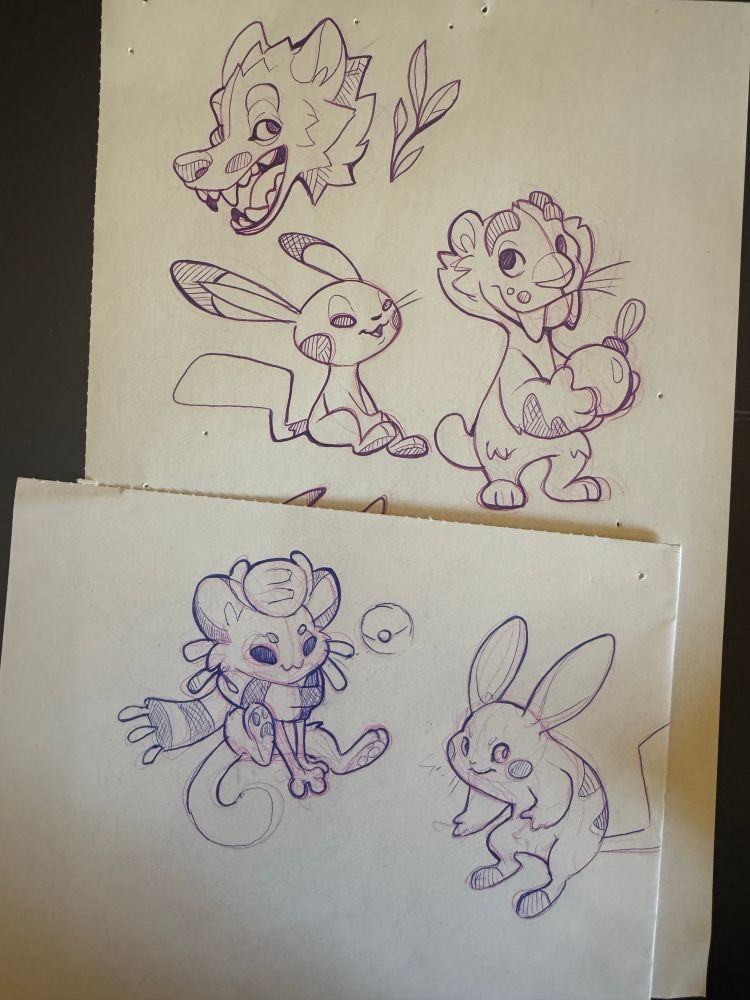 Sketch page of pokemon and saber cat
