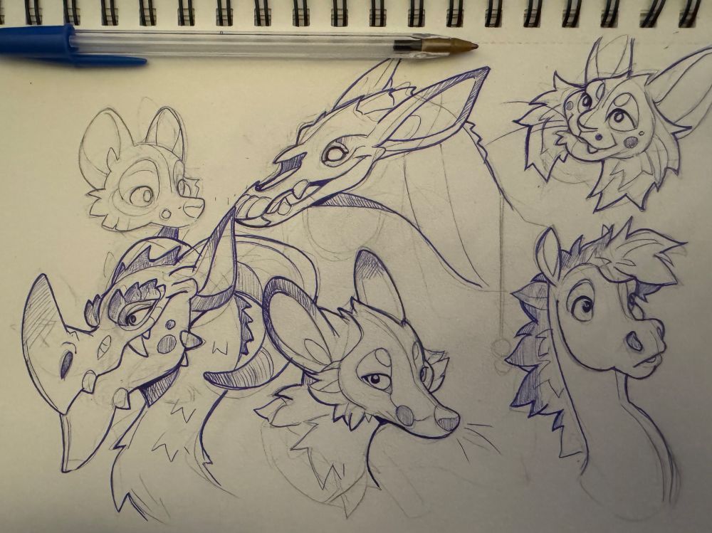 Sketch page of critter heads
