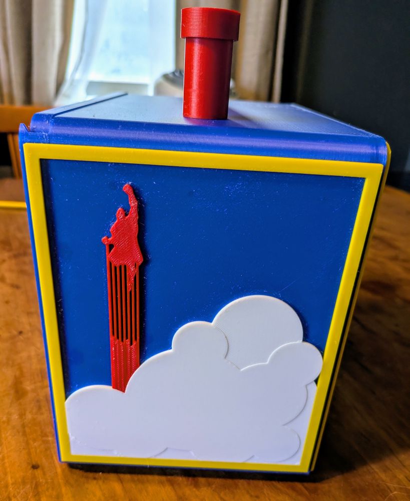Side view of case with Superman in sillouette flying up through clouds