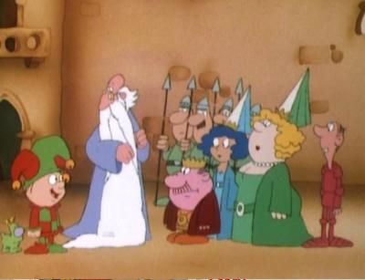 A still from the short-lived 1985 cartoon Alias The Jester. A number of cartoon characters stand around in typical medieval garb, including the titular jester, a wizard, a king, queen and princess and various guards.