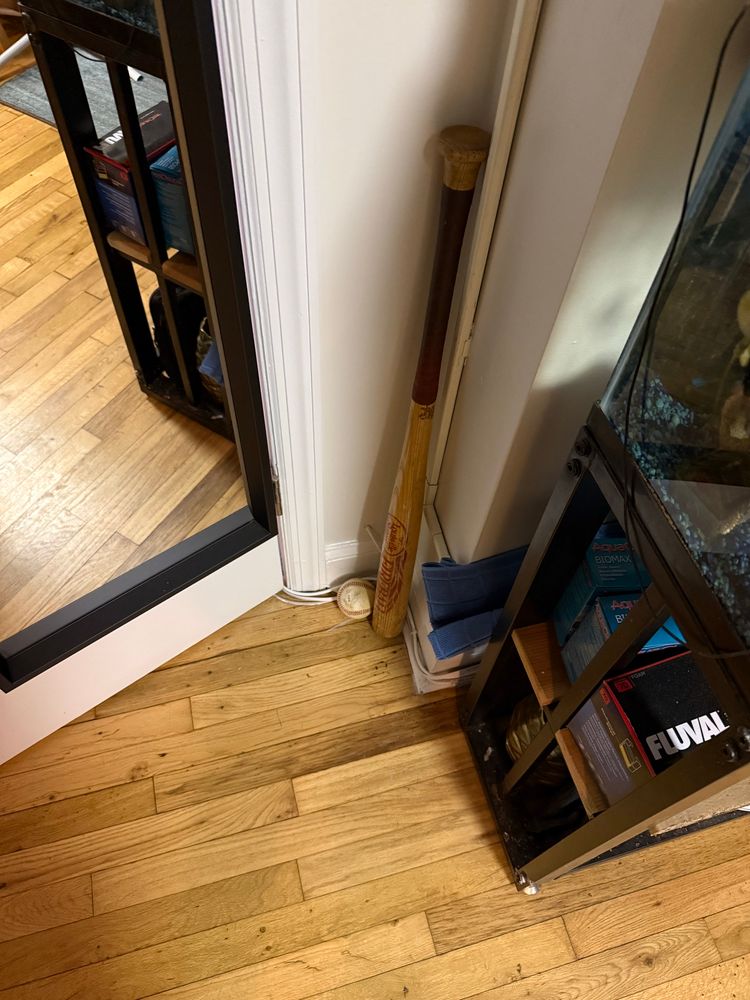 My baseball bat (& ball) in the corner of my apartment 