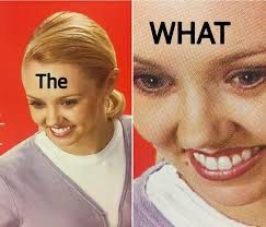 The what? Close up on a woman’s smiling yet shocked expression 