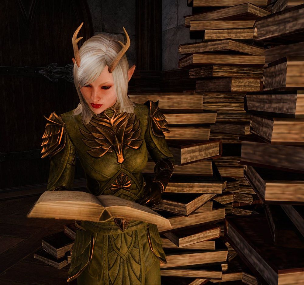 Dot reading next to a massive piles of books. 