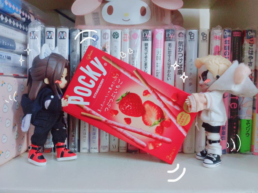 my custom dolls jay and darby, carrying together a pocky box.