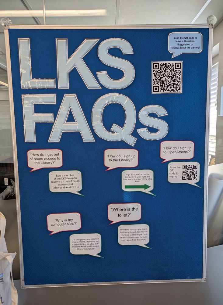 Blue board with LKS FAQs in large pale blue letters, features some Q&As and a QR code to leave questions and comments