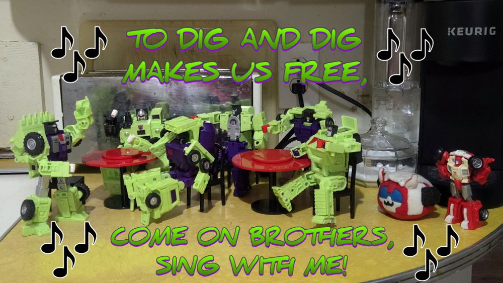 The scene zooms out even more to show that Swerve & Puggle Swerve are looking on at the Constructicons, who CONTINUE to sing, "To dig and dig makes us free, come on brothers, sing with me!"
