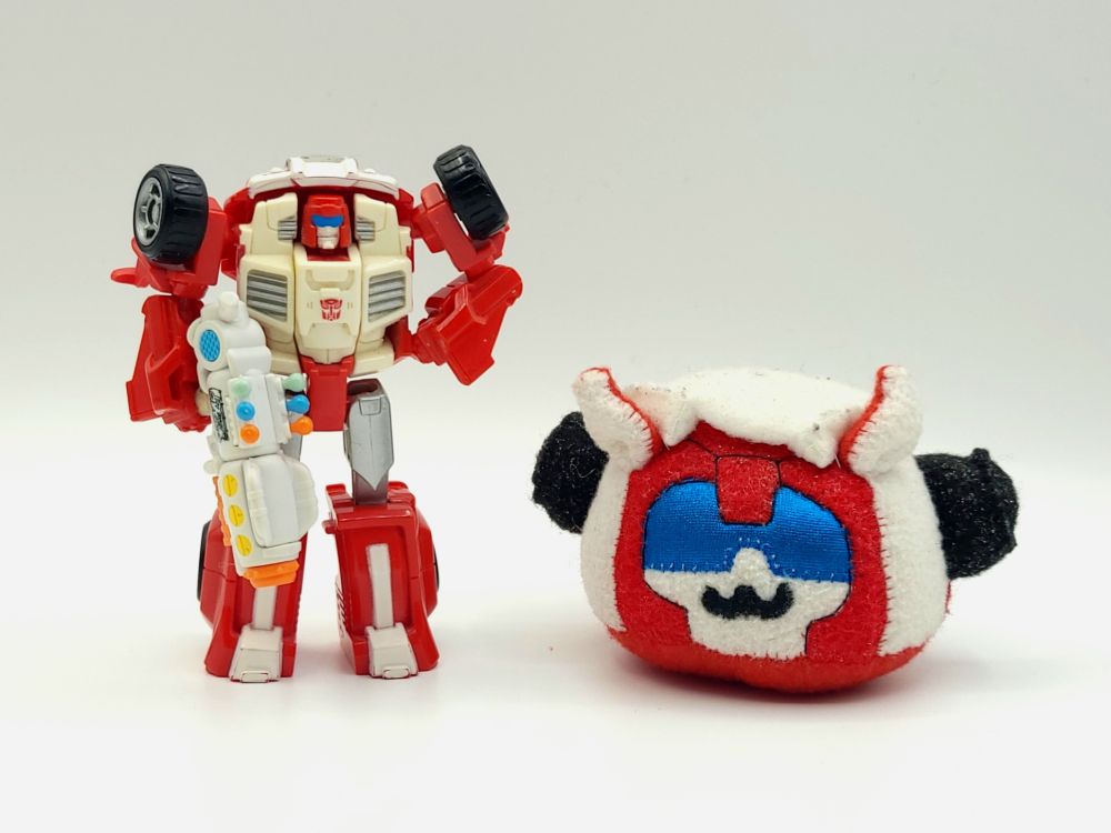 A Thrilling 30 Swerve standing beside a hand-crafted Puggle Swerve plush.