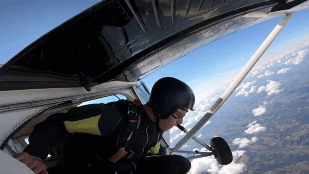 a man in a helmet is flying through the air