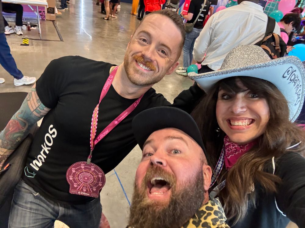 Three people smiling at the camera