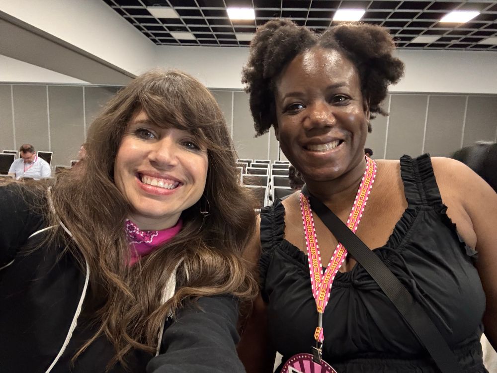 Two women smiling at camera 