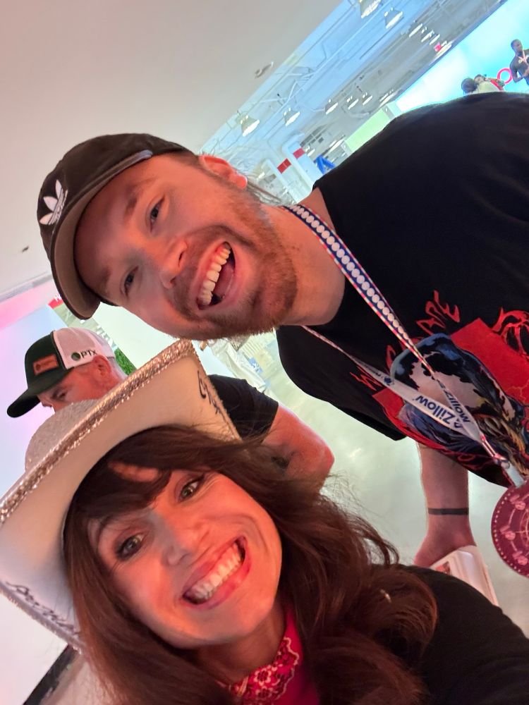 Two people smiling at the camera 