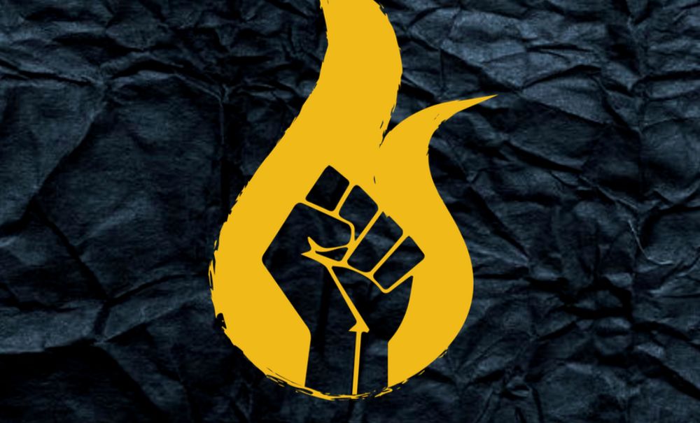 Black Power fist over burning golden-yellow flame