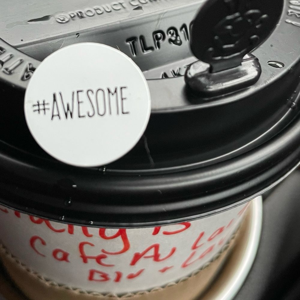 Sticker that says #Awesome in coffee cup