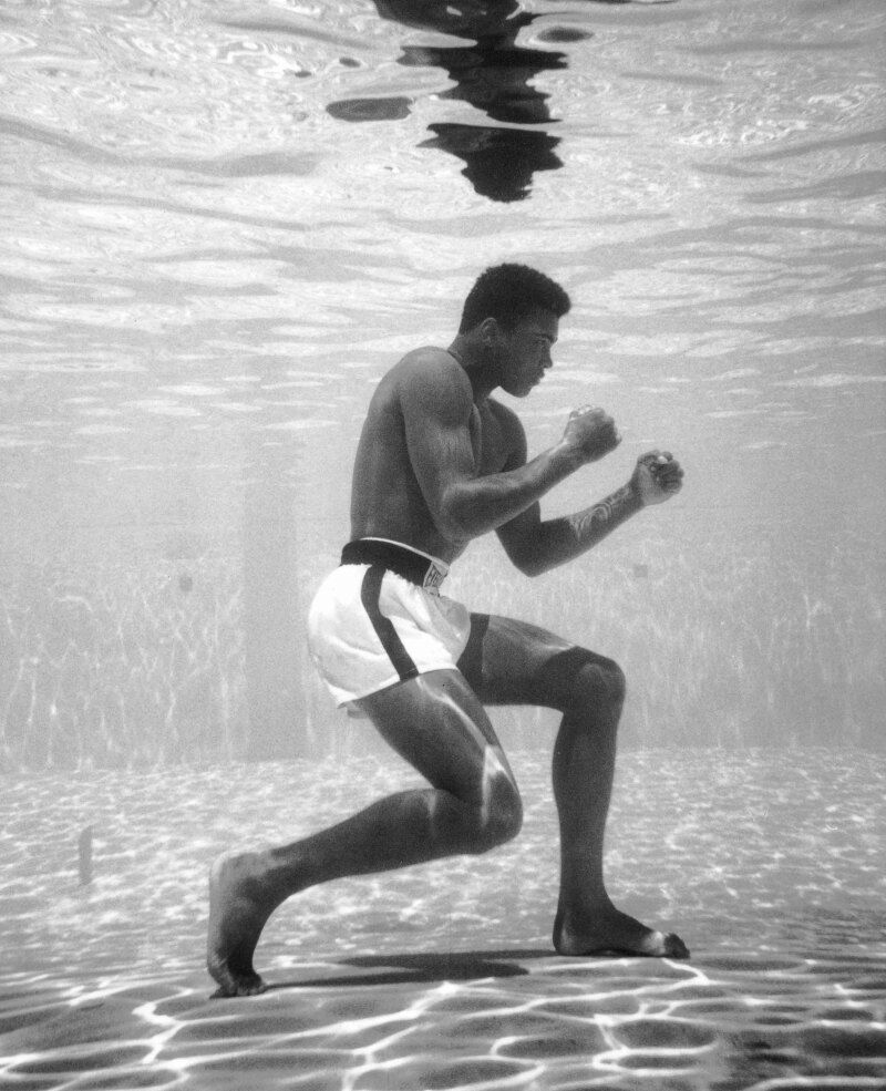 Muhammad Ali prone on the pool's bottom (underwater)