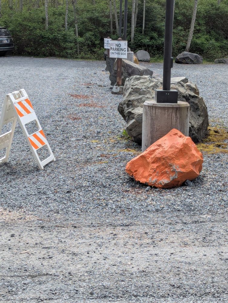A mysterious, bright orange rock. The geology in Alaska is fascinating 