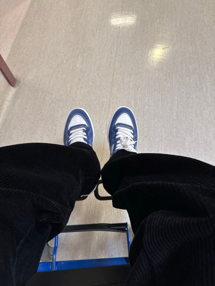 Middle-aged man with pants and shoes on.