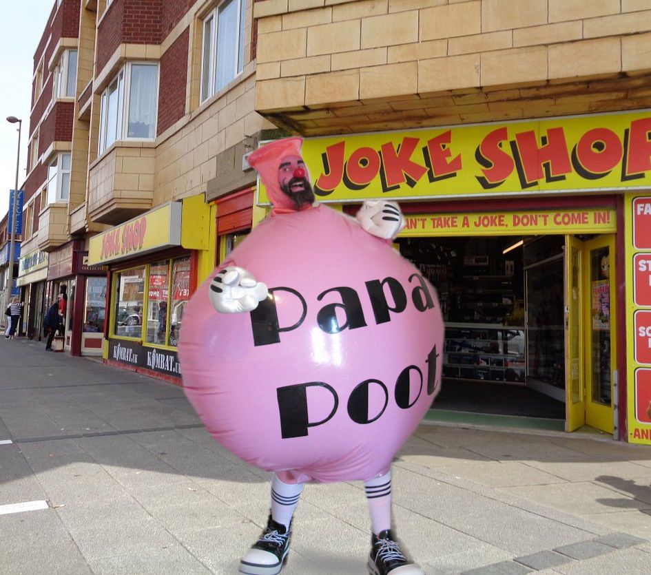 a clown in a whoopie cushion suit sticking our his finger 