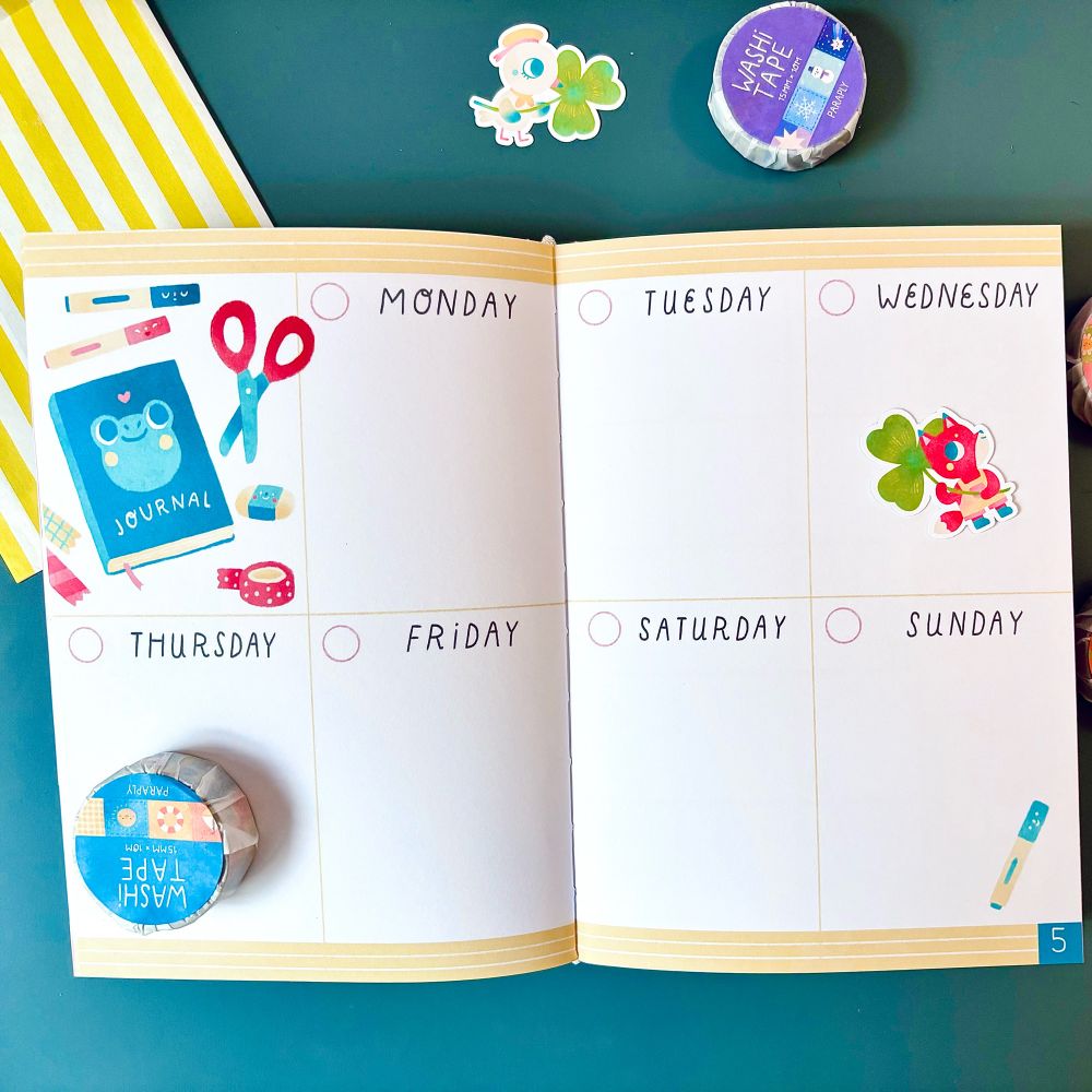 The inside of the the yearly planner, in a weekly plan. It has a cute drawing of a journal on it.