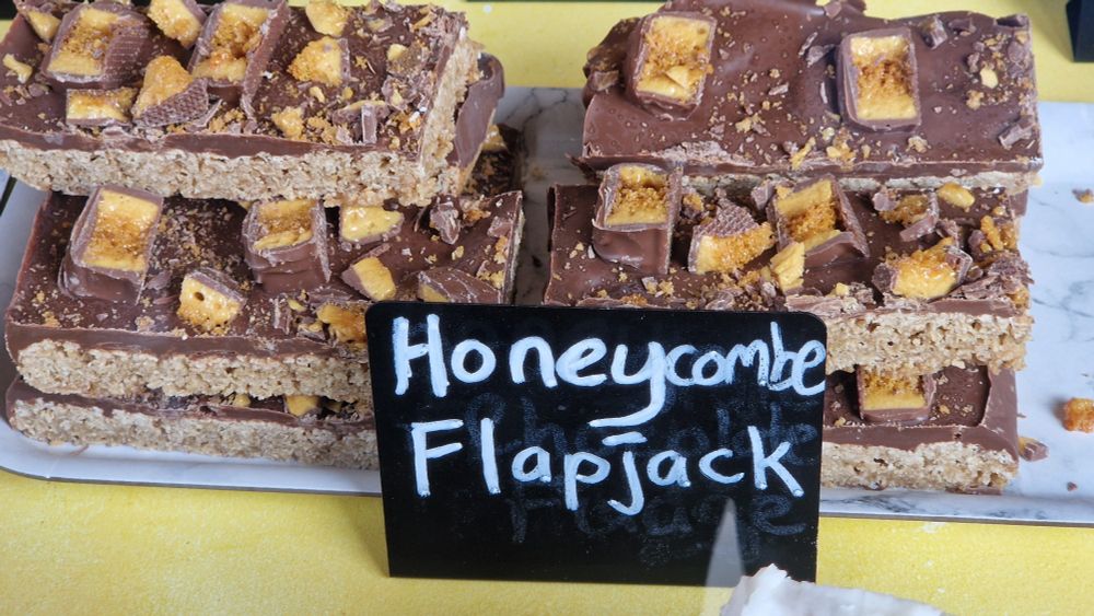 Some delicious treats with a label reading "honeycombe flapjack"