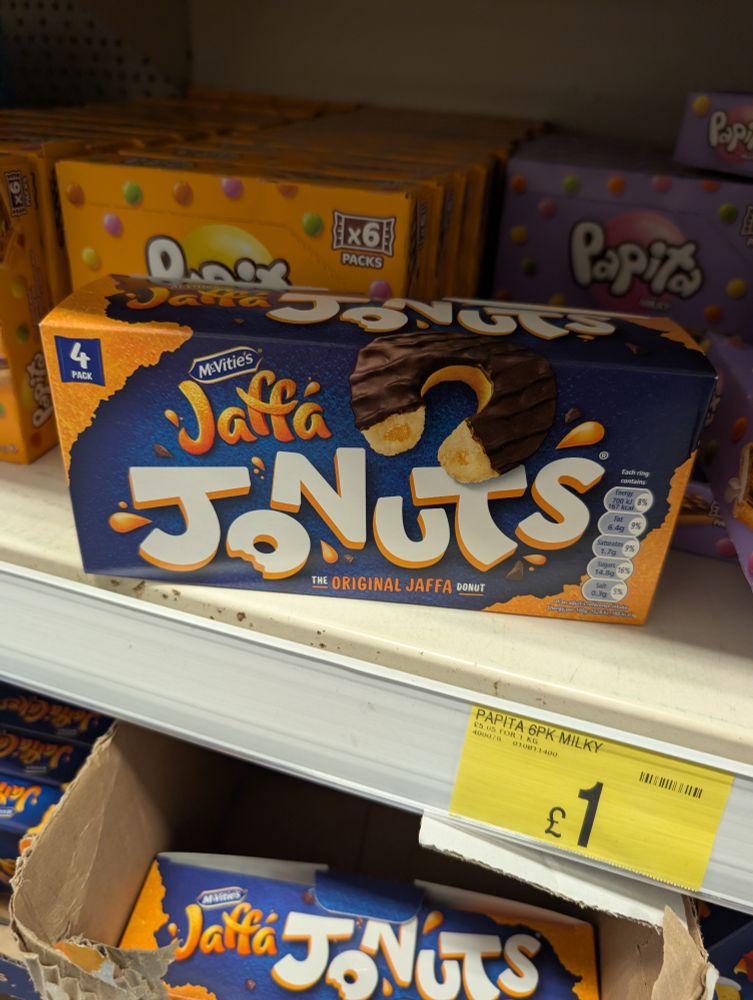 A lonely pack of Jaffa 'Jonuts' cakes on the shelf of a poorly lit B&M store