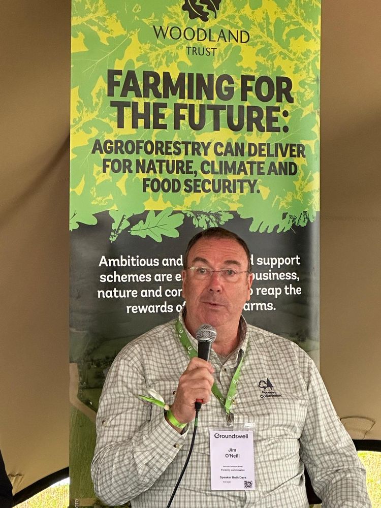 Jim O'Neill with microphone in hand