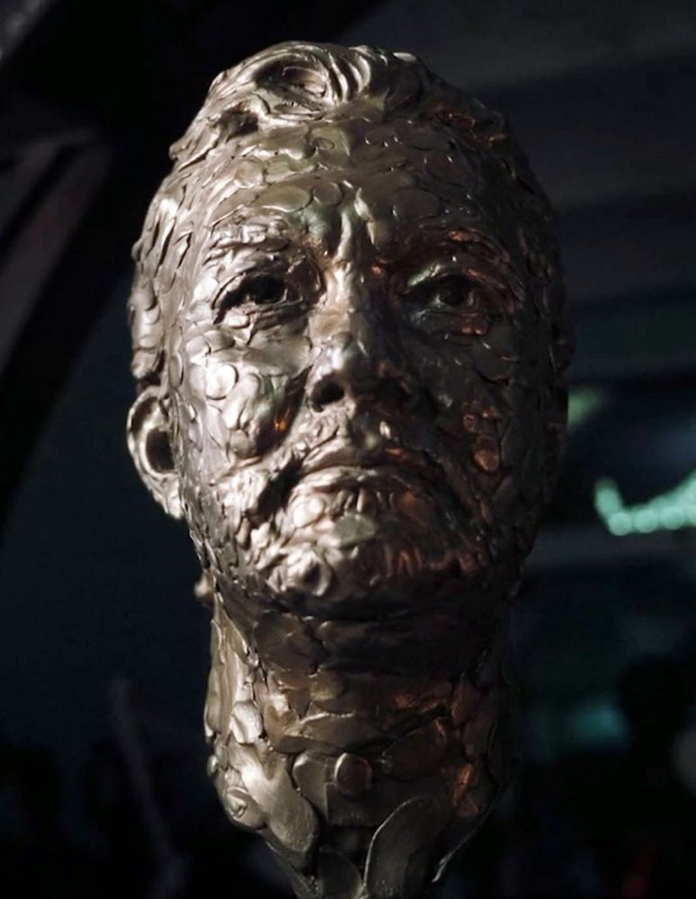 Gilded bronze head of Douglas Latchford.