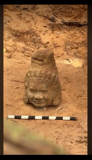 Asura stone head, 13th century found at Angkor Thom gate, Cambodia.