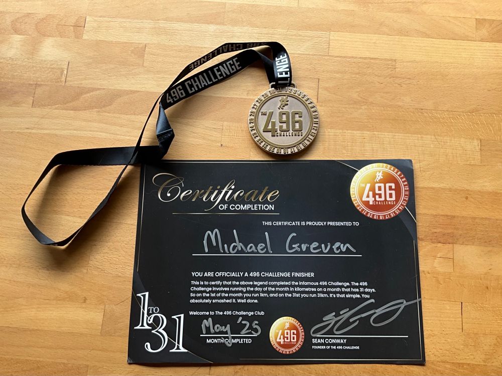 Medal and certificate showing the inscription of the 496 challenge as well as certifying that I finished