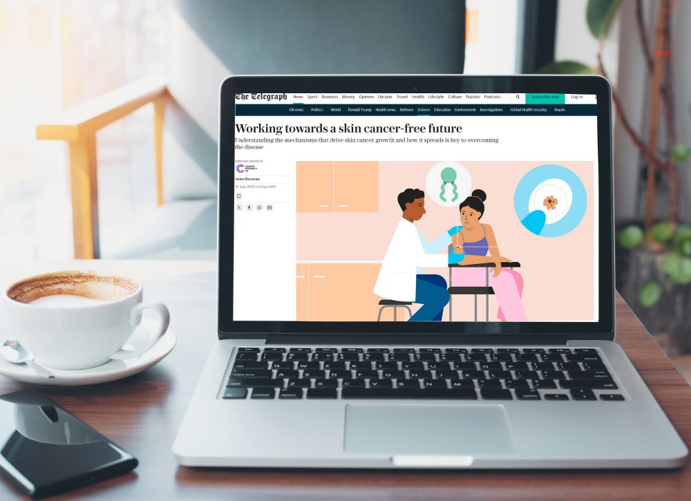 Graphic shows a laptop computer on a table with a coffee cup and mobile phone alongside

On the screen is an image from the Telegraph website entitled "Working towards a skin cancer-free future" with an illustration of a doctor attending a patient with suspected skin cancer