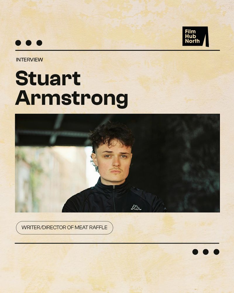 Text reads: ‘Interview: Stuart Armstrong’: ‘writer/director of Meat Raffle’. Photograph of Stuart with arms crossed, looking into the camera. He has dark hair styled as a short mullet and a trimmed mustache. 