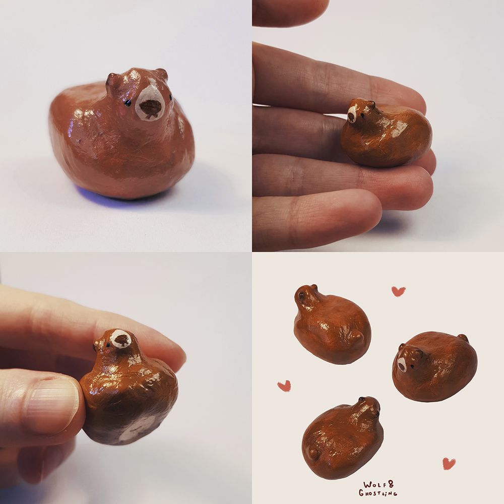 a very small, bean shaped brown bear sculpture with a cute little face