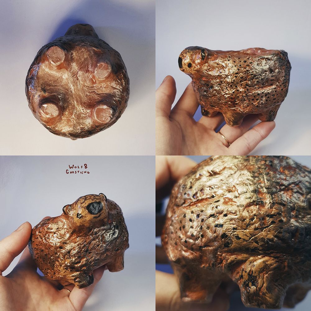 a handmade succulent plant pot in the shape of a bear