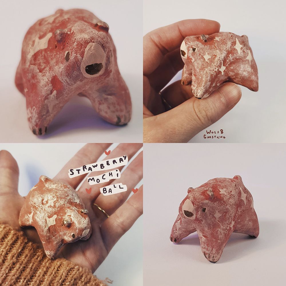 a small, round figurine of a pink bear with a frosted dusty appearance. stars are painted on her. she looks like a mochi ball