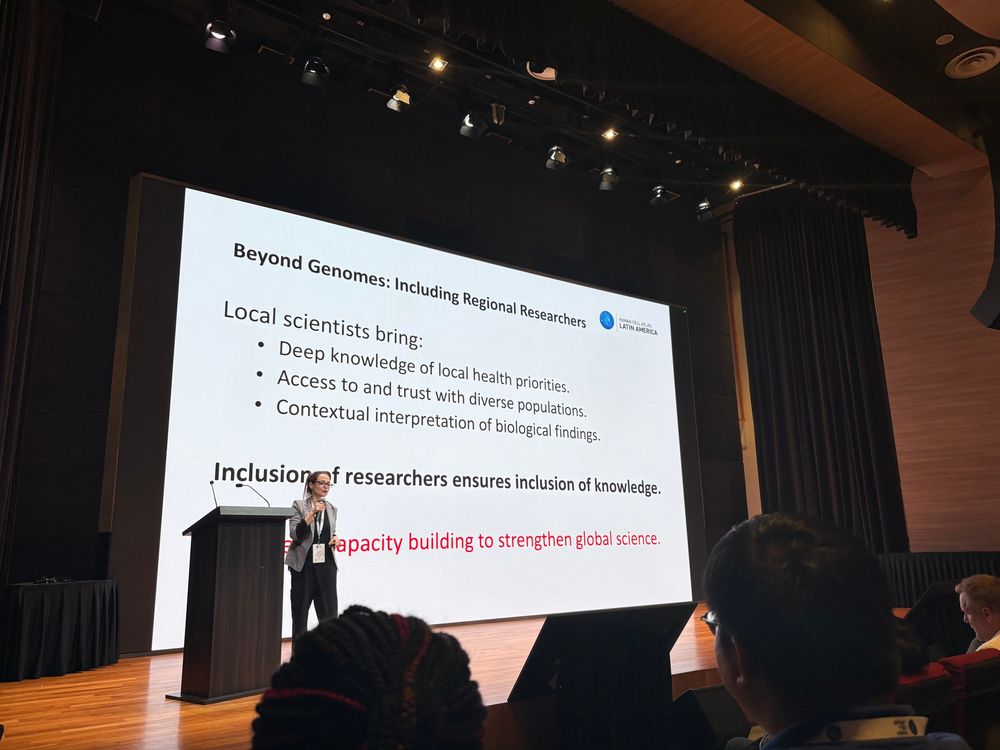 A woman speaks to an audience about the importance of leveraging local experts in global science missions