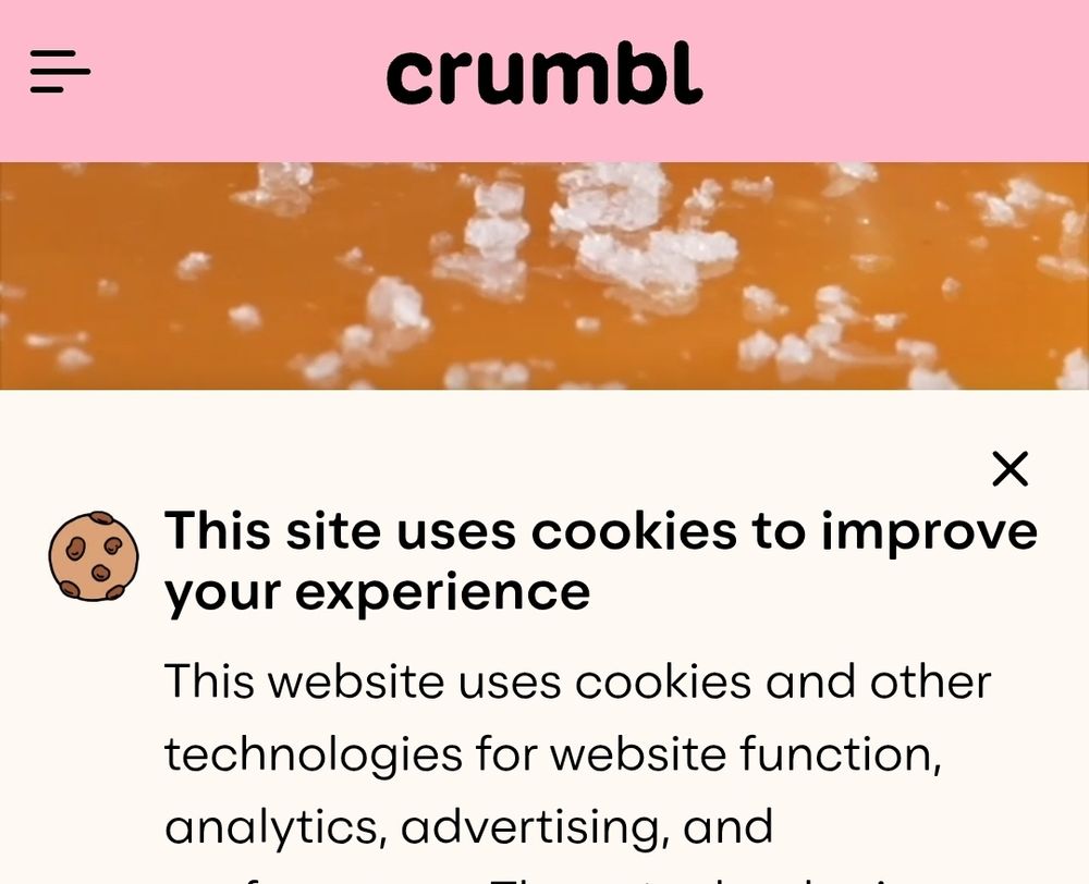 A "This site uses cookies to improve your experience" message on the website of Crumbl, a leading purveyor of actual, edible cookies.