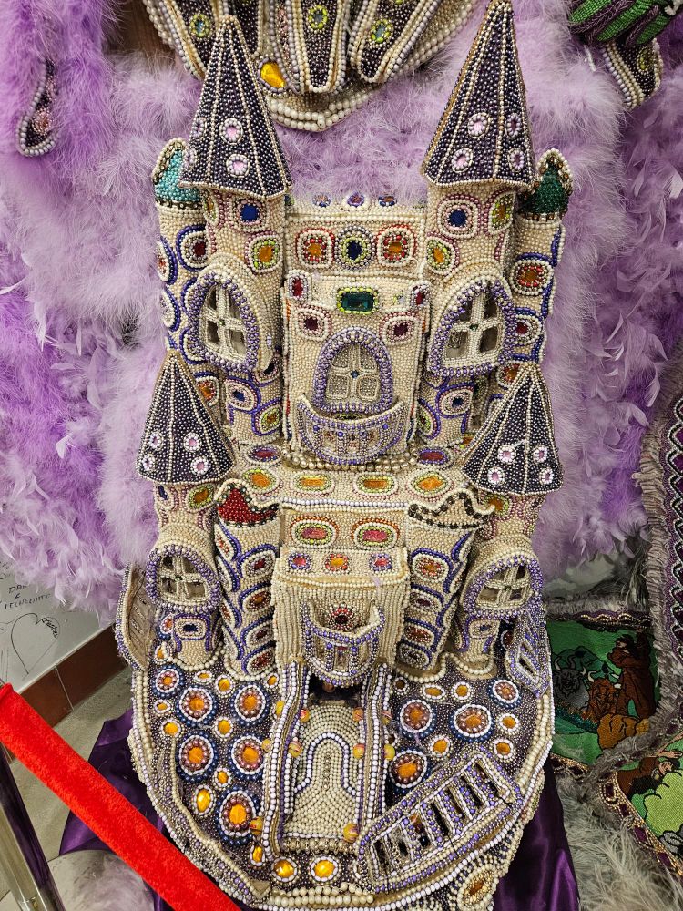 An ornate castle design covered entirely in beads.