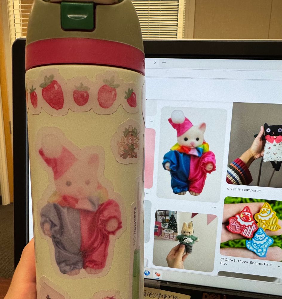 little calico critter (sylvanian family figurine) dressed as a clown on pinterest with a faded sticker from my water bottle showing the exact same figure in the same costume