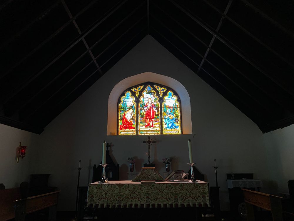 Church stained glass window at sunset 