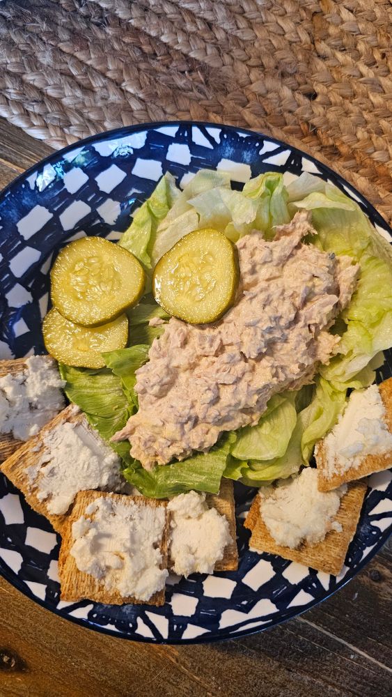Tuna salad on lettuce, homemade pickles from a neighbor,  marinated goat cheese on triscuits.