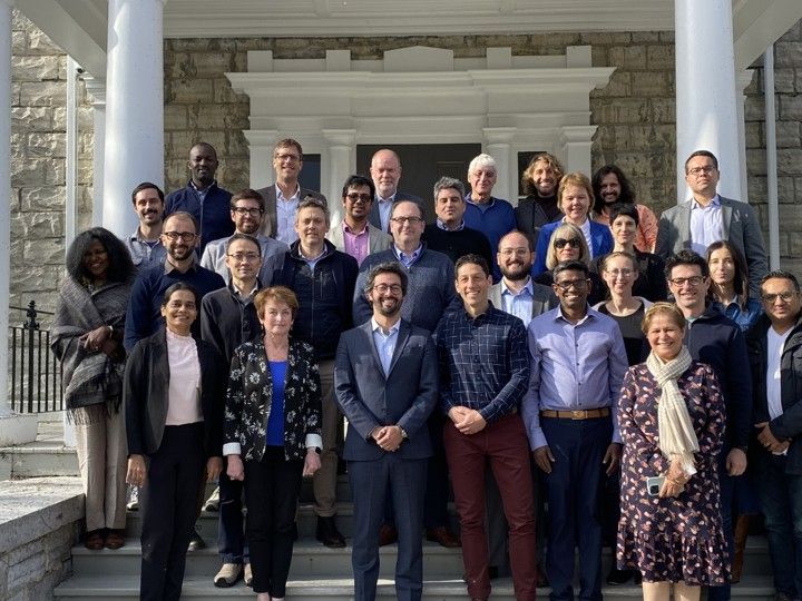 Leaders of Common Sense Oncology standing in front of the pillars of a building. 