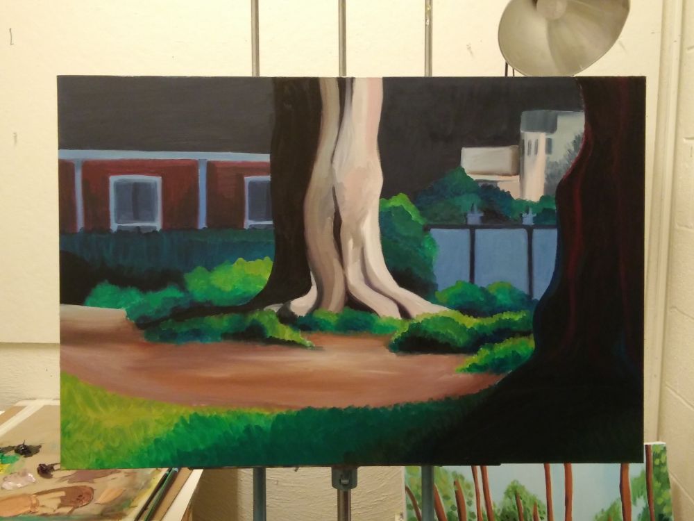 An oil painting of a tree. It's very dark out, but there's a bright light shining directly on the tree. The tree is sort of a pale grey with lots of bushes around it.