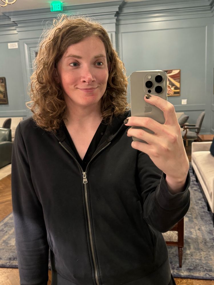 A selfie in a black hoodie